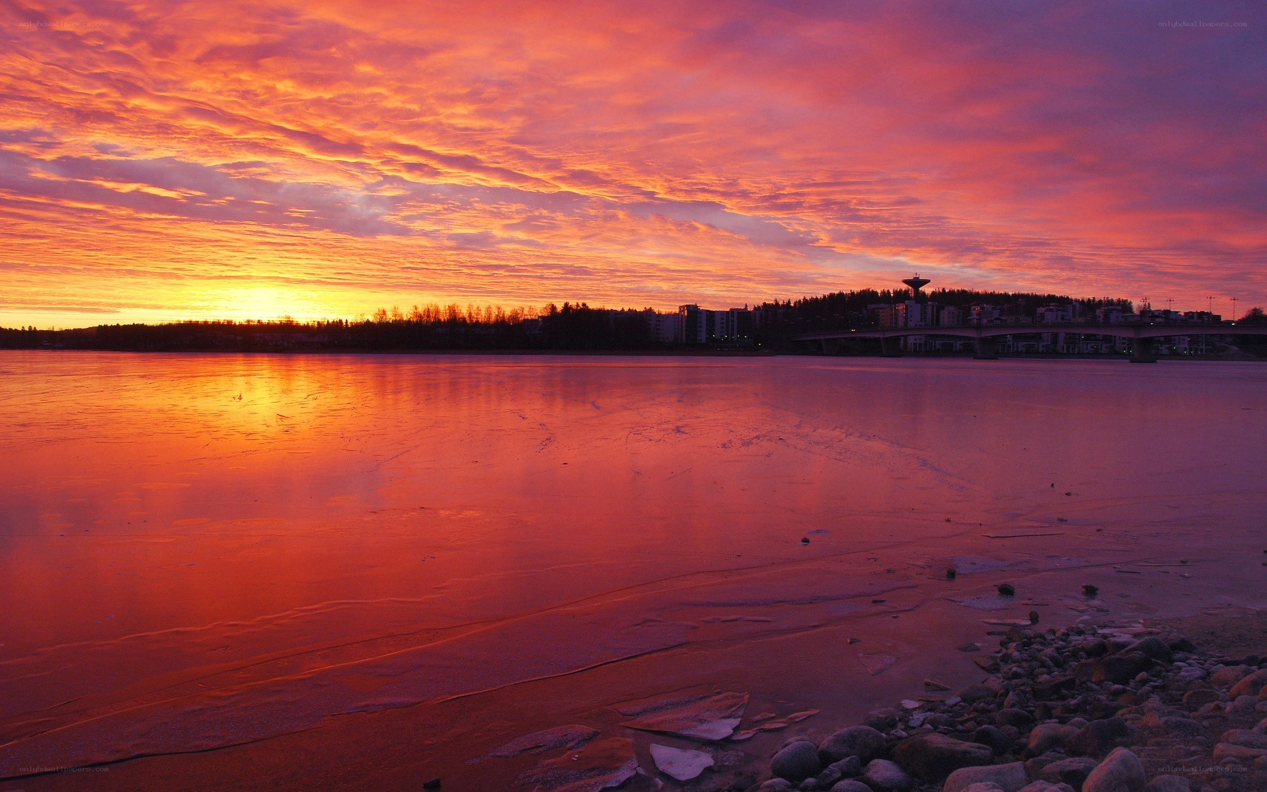 Vibrant sunset over frozen river