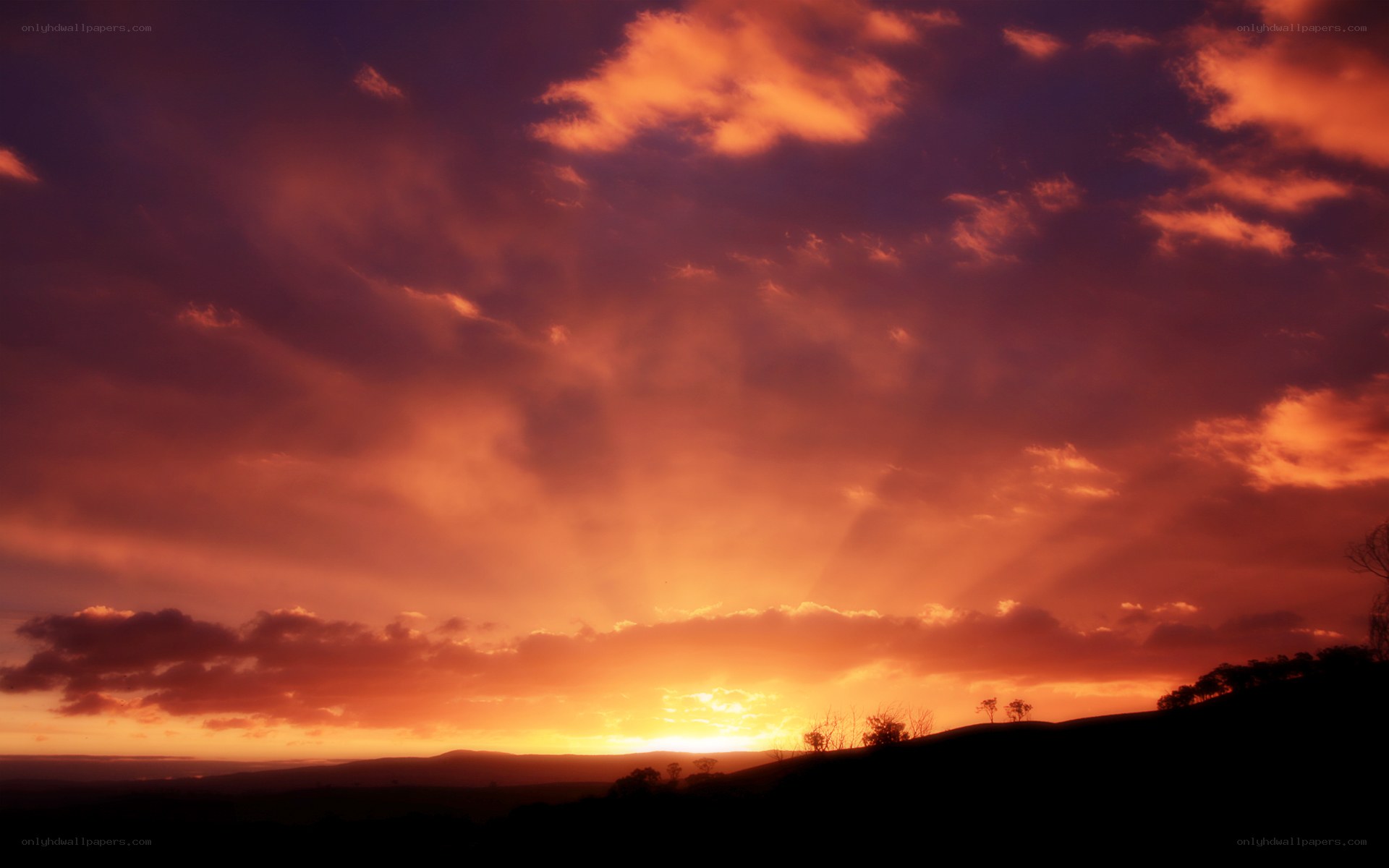 vibrant sunset over hills