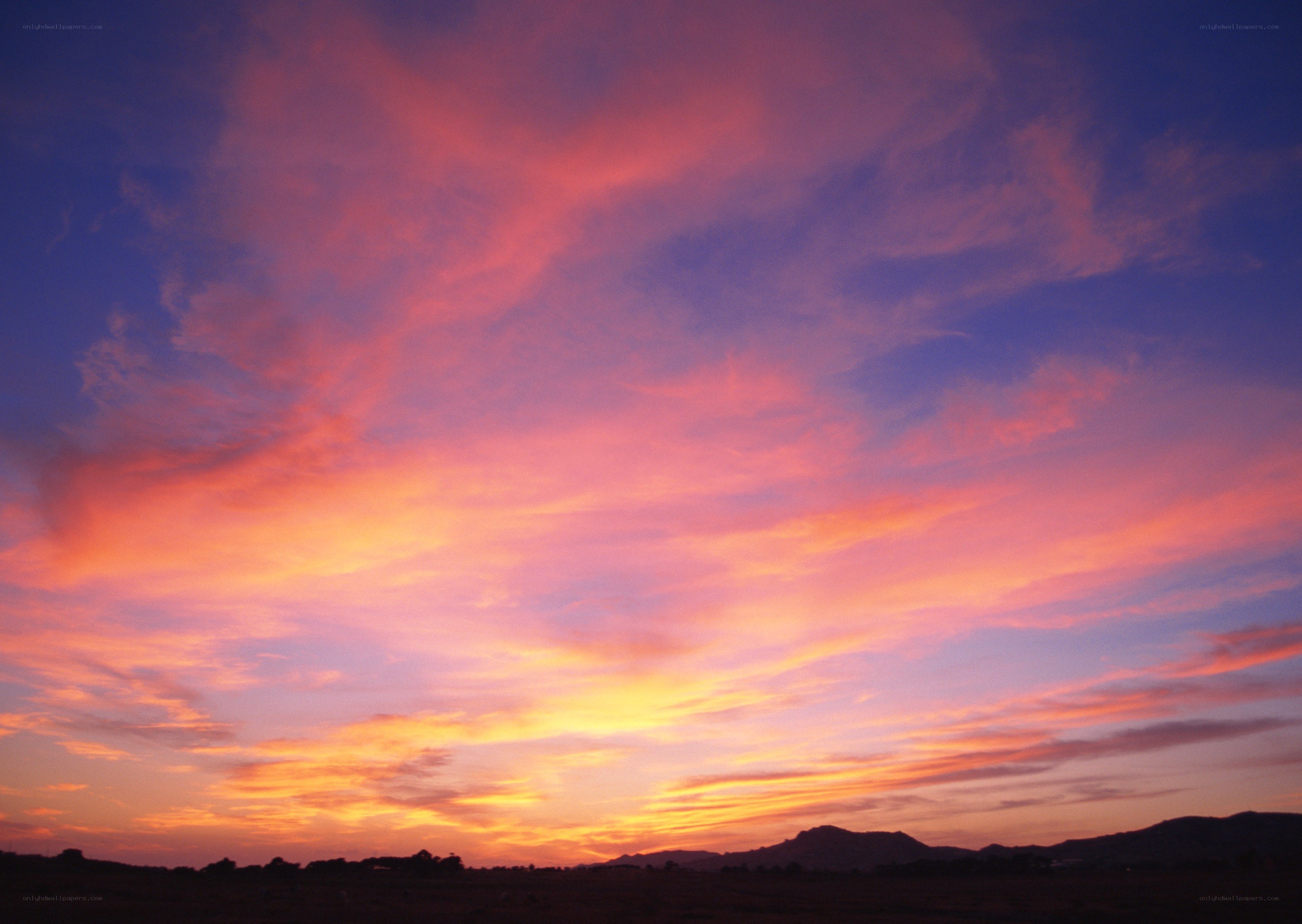 Vibrant sunset over hills