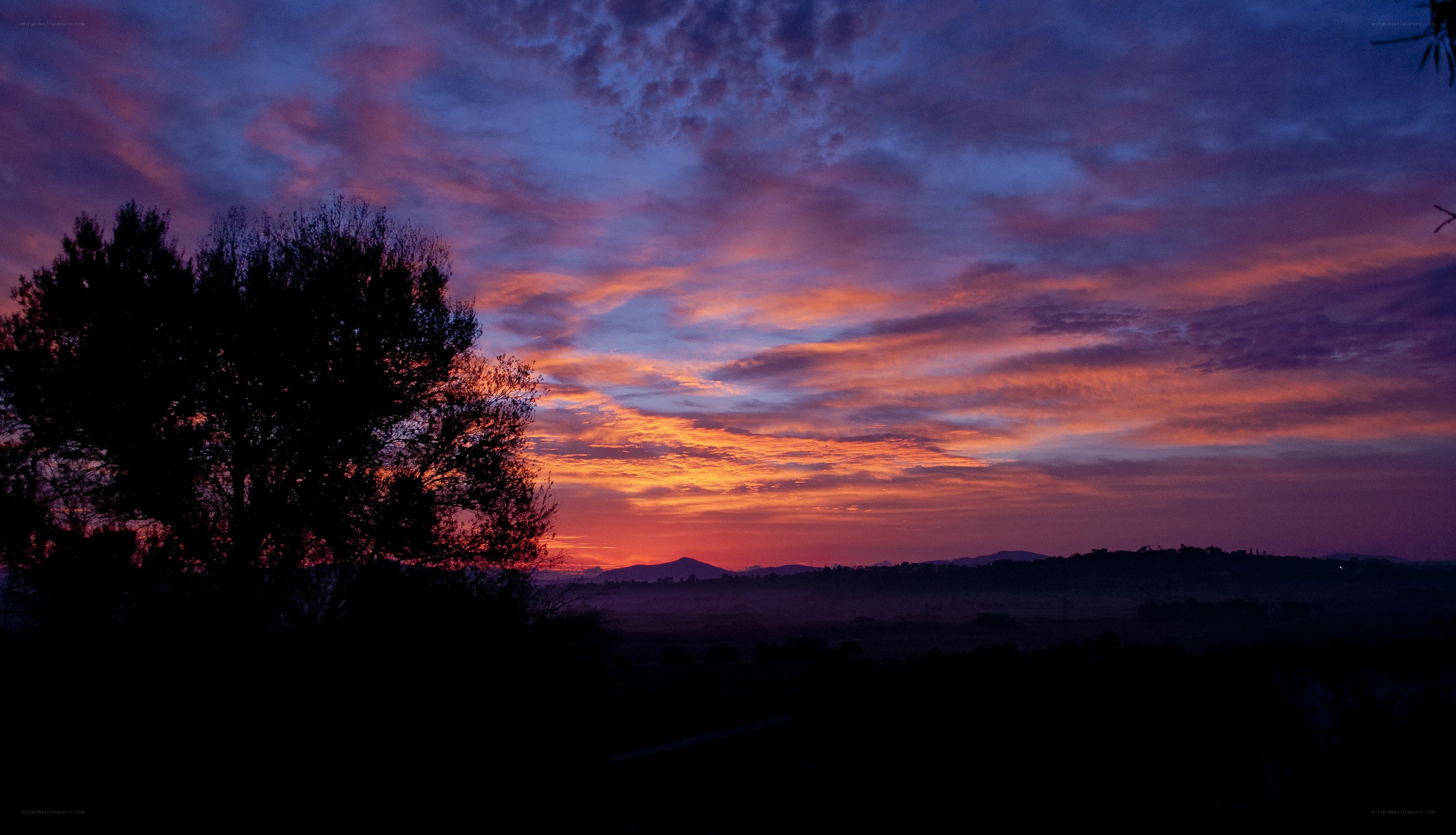 vibrant sunset over hills