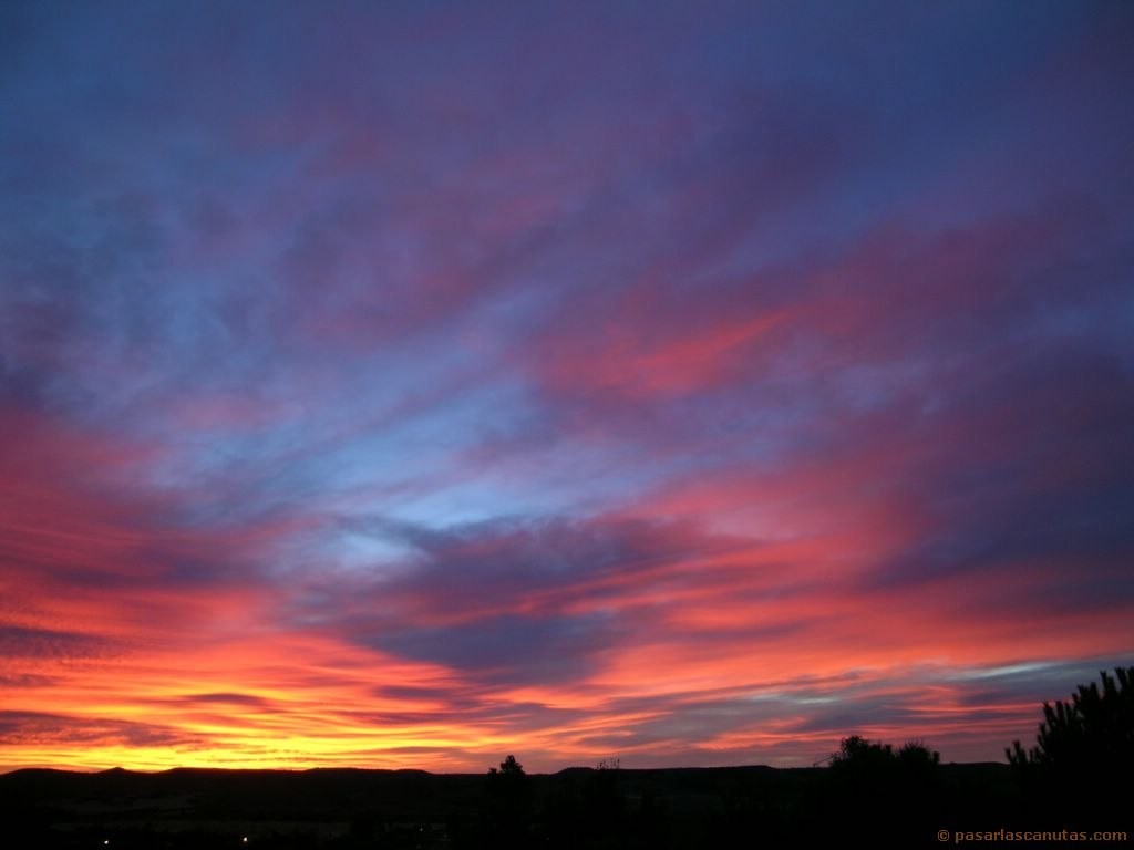 vibrant sunset over hills