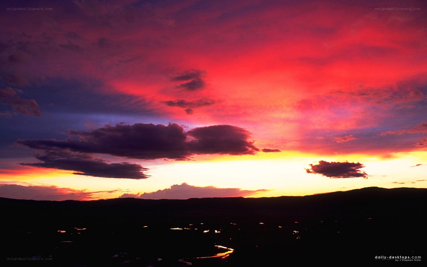 vibrant sunset over hills