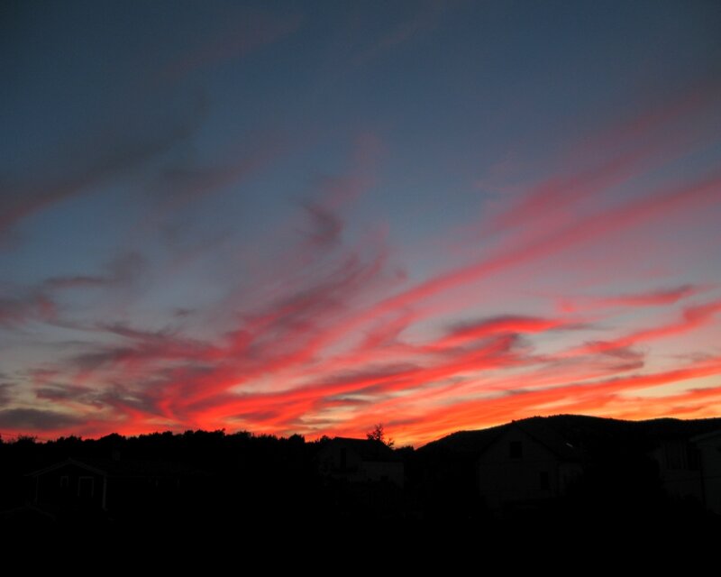 vibrant sunset over houses