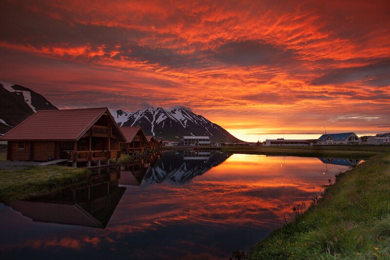 Vibrant sunset over Icelandic cabins