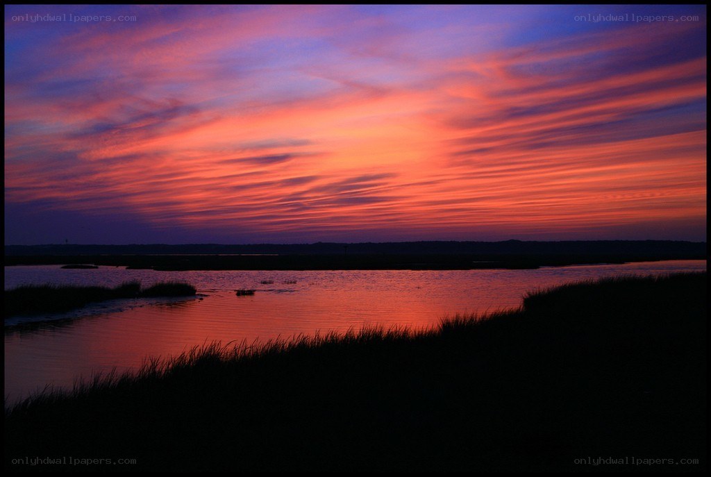 vibrant sunset over marsh
