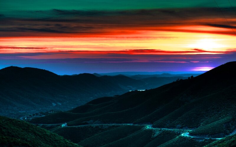 Vibrant sunset over mountain hills