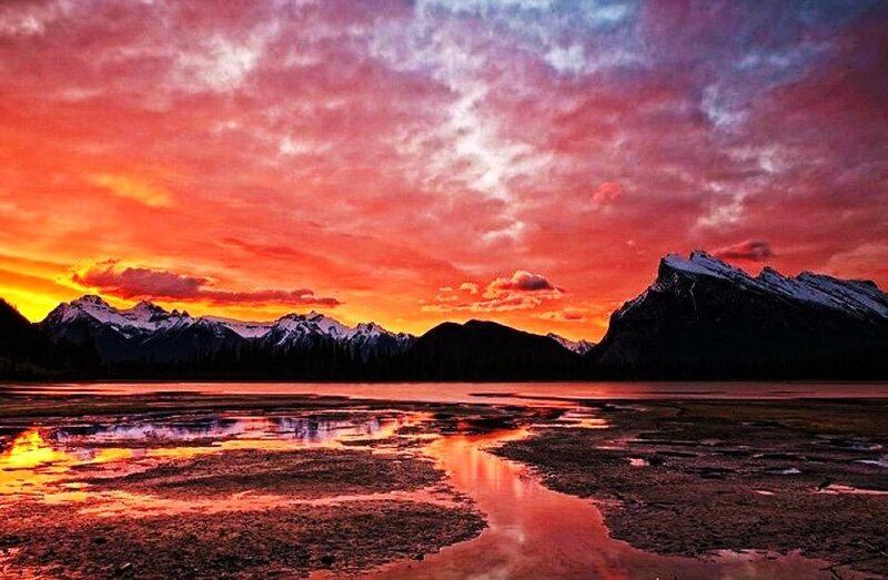 Vibrant sunset over mountain lake