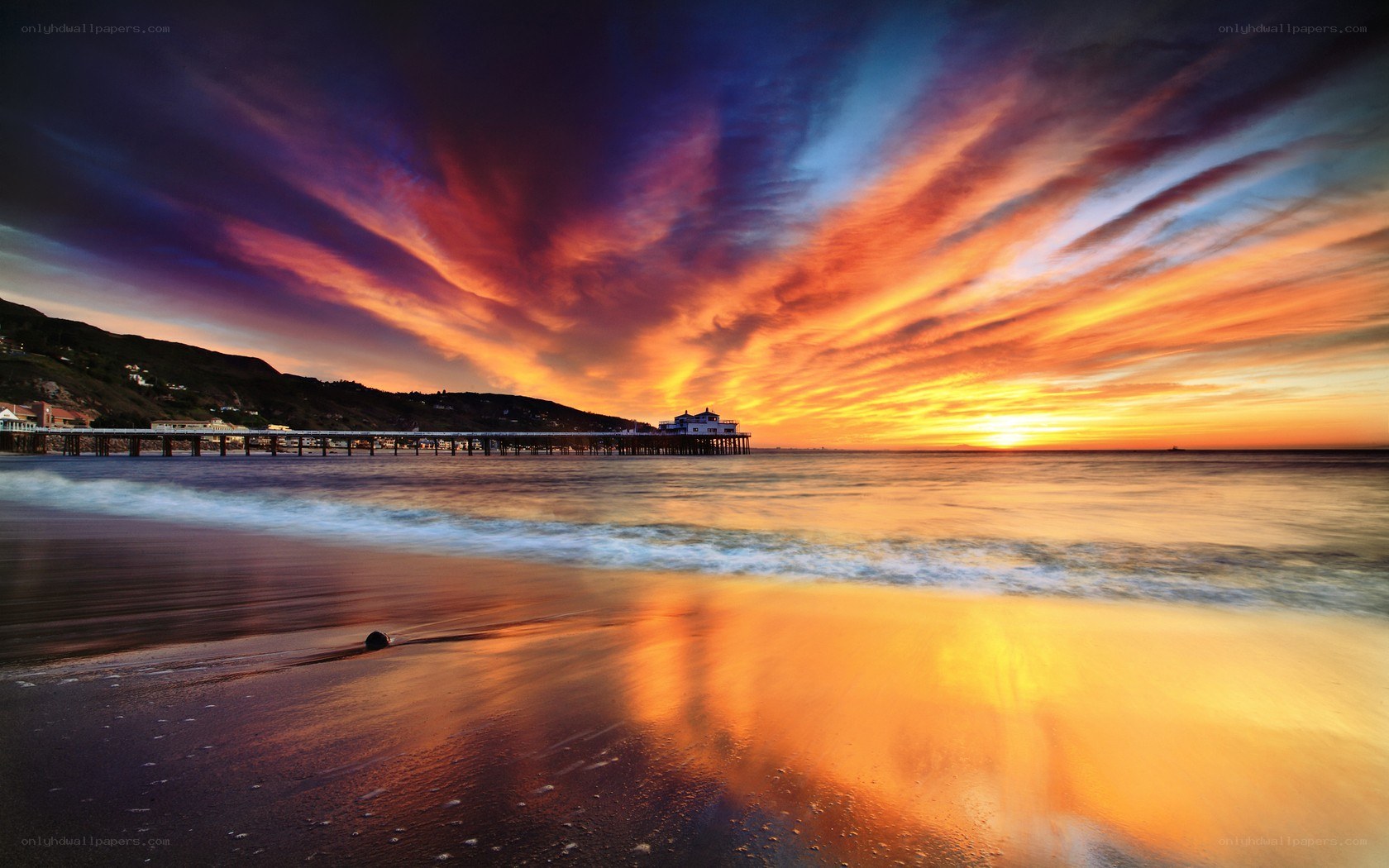 Vibrant sunset over ocean pier