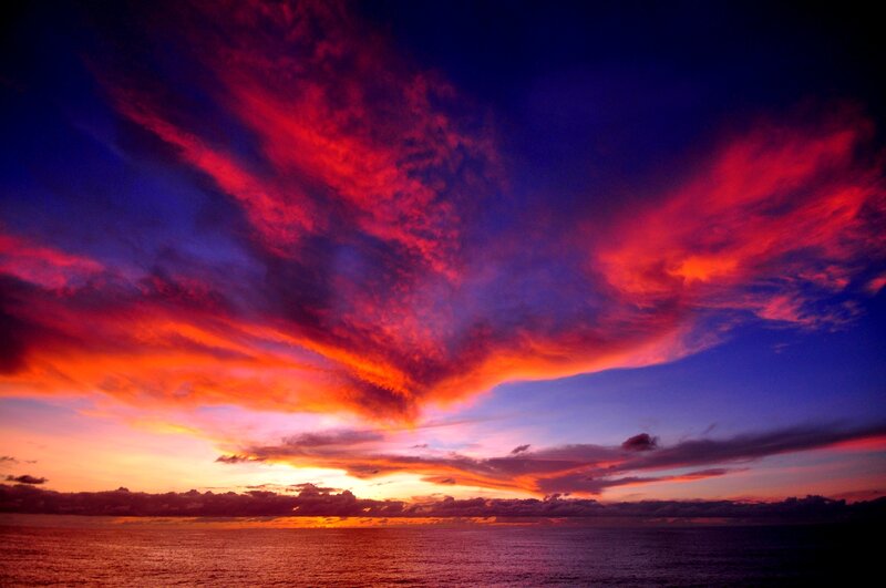 Vibrant Sunset over Ocean — Red