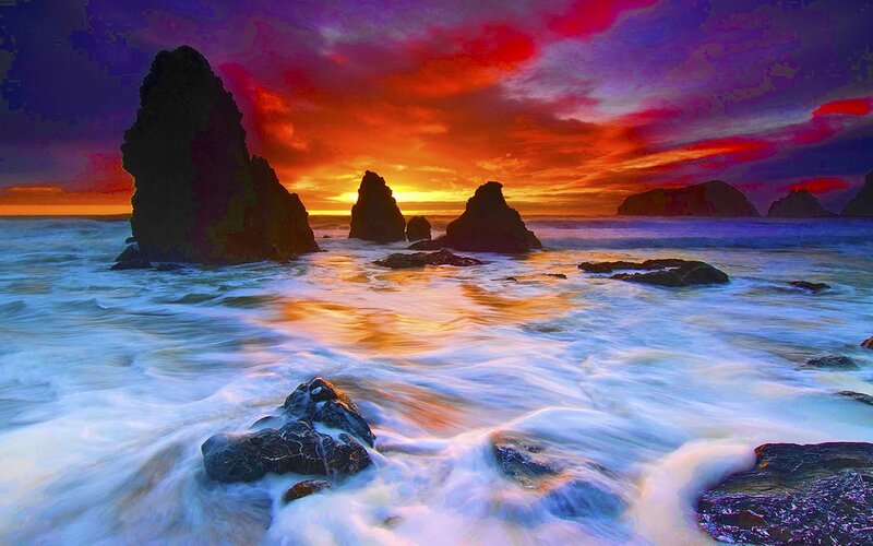 Vibrant sunset over ocean rocks