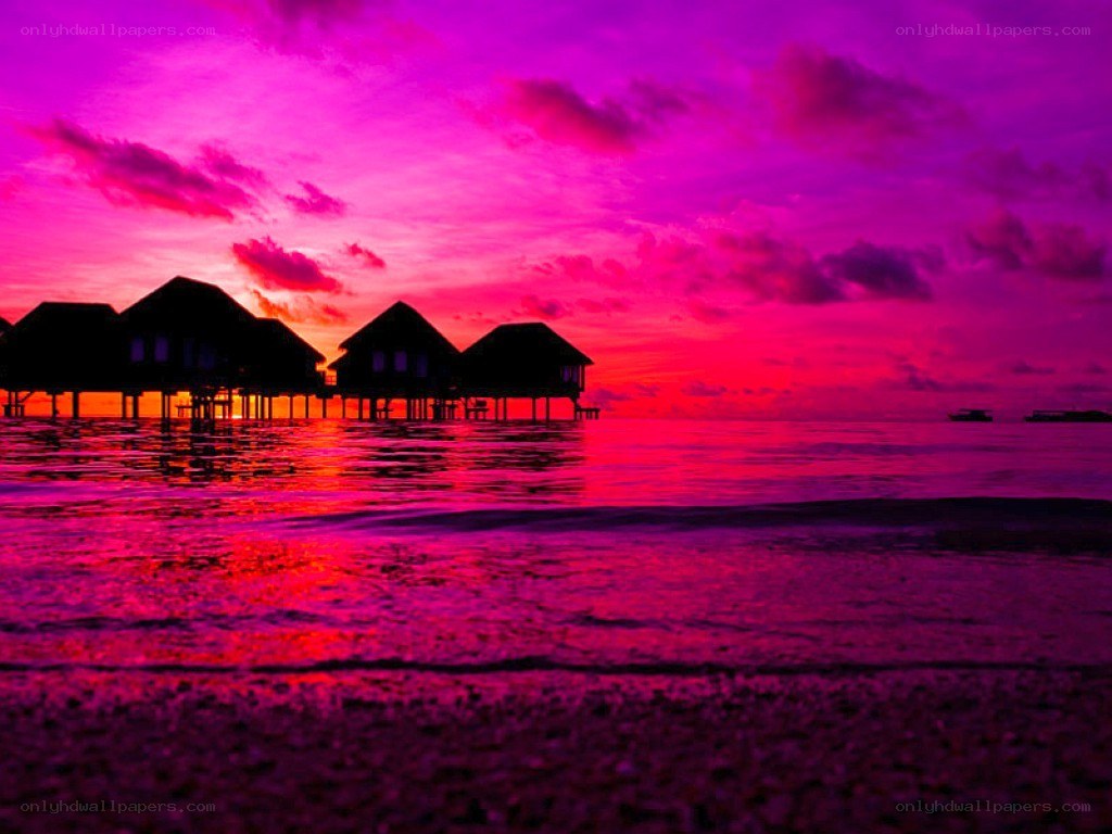 Vibrant sunset over ocean villas