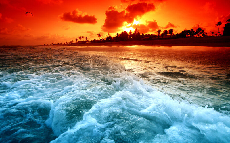 Vibrant sunset over ocean waves