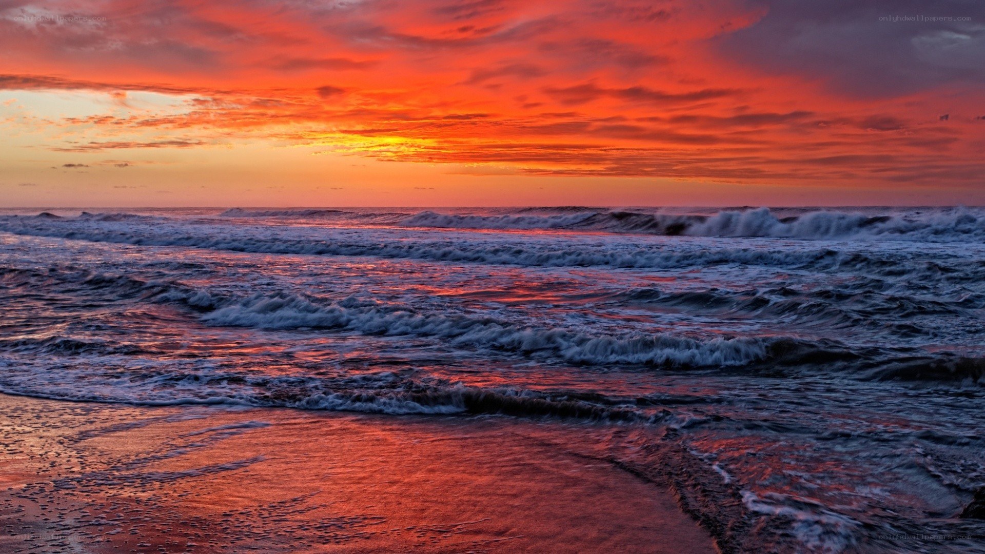 Vibrant sunset over ocean waves
