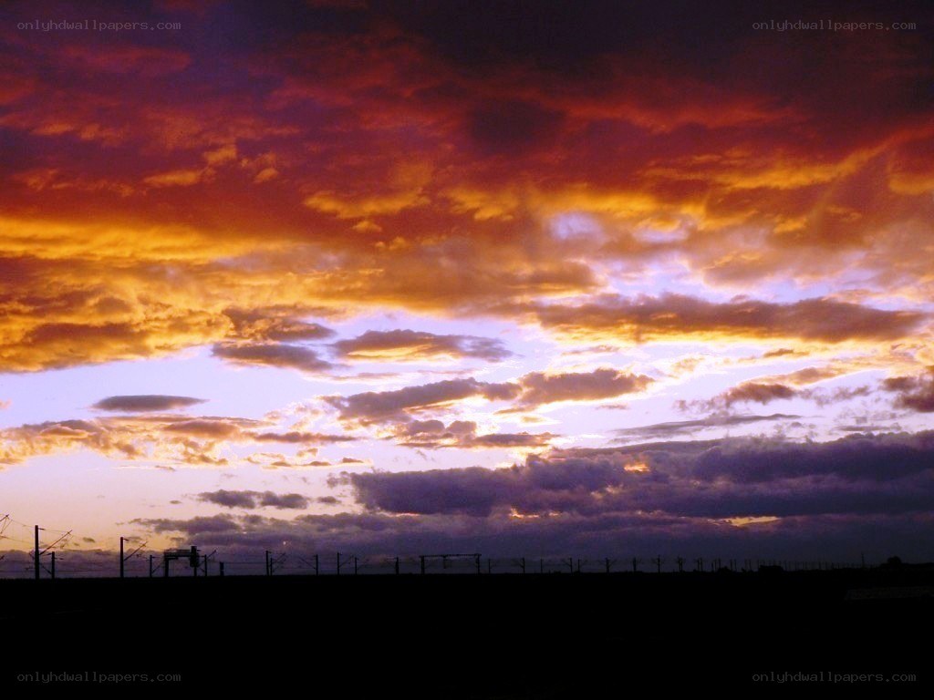Vibrant sunset over railway