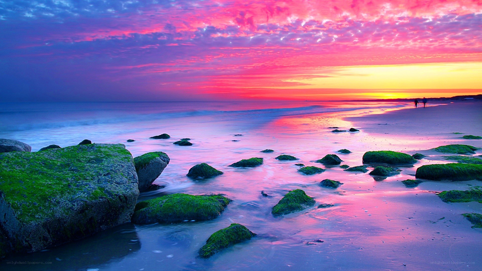 Vibrant sunset over rocky beach