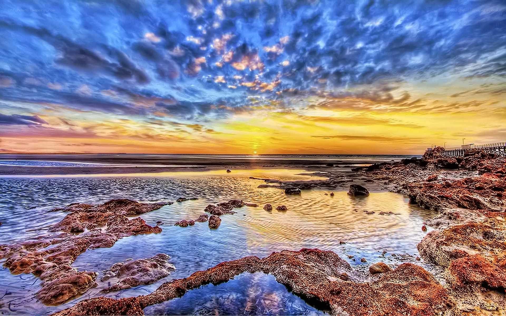 Vibrant sunset over rocky beach