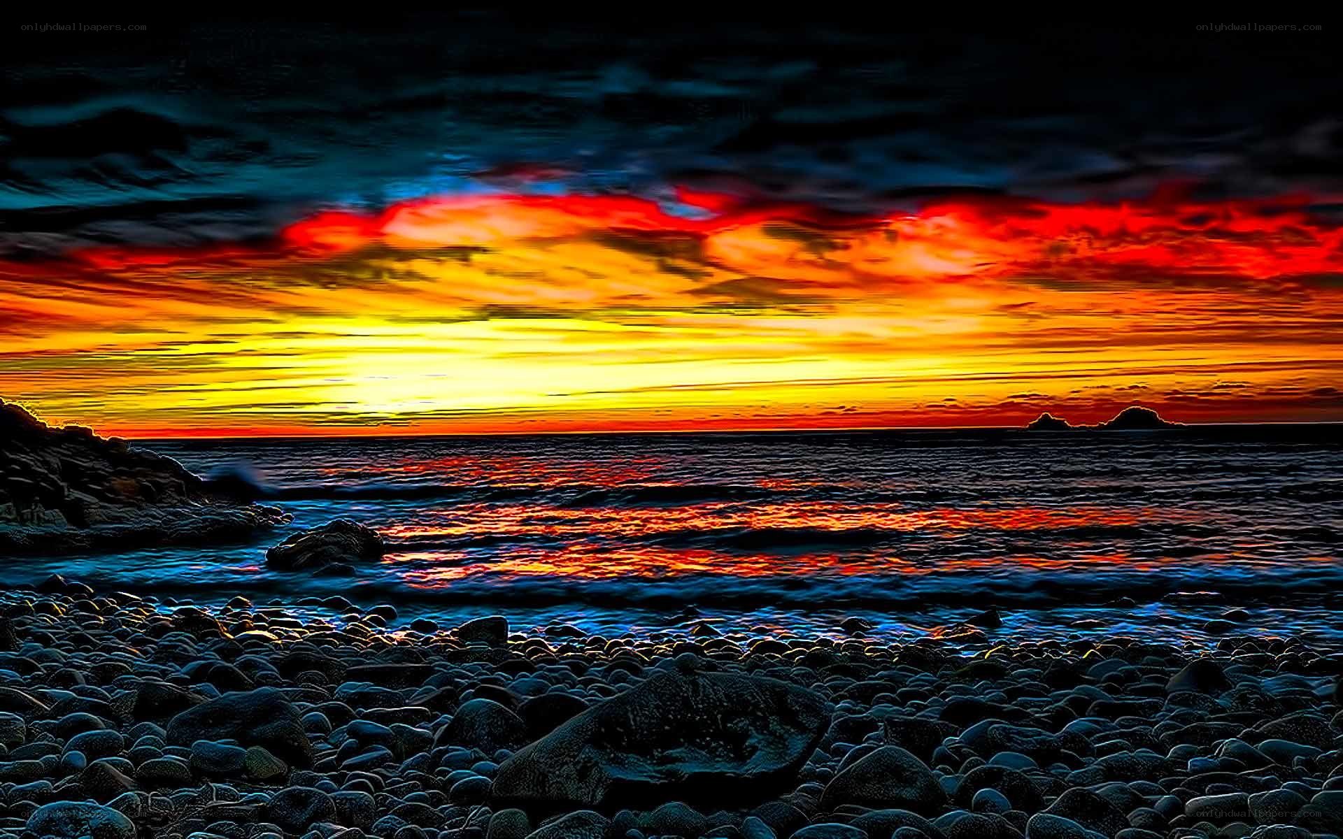 Vibrant sunset over rocky beach