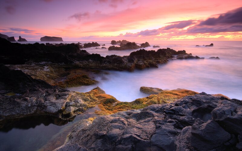 Vibrant sunset over rocky coast