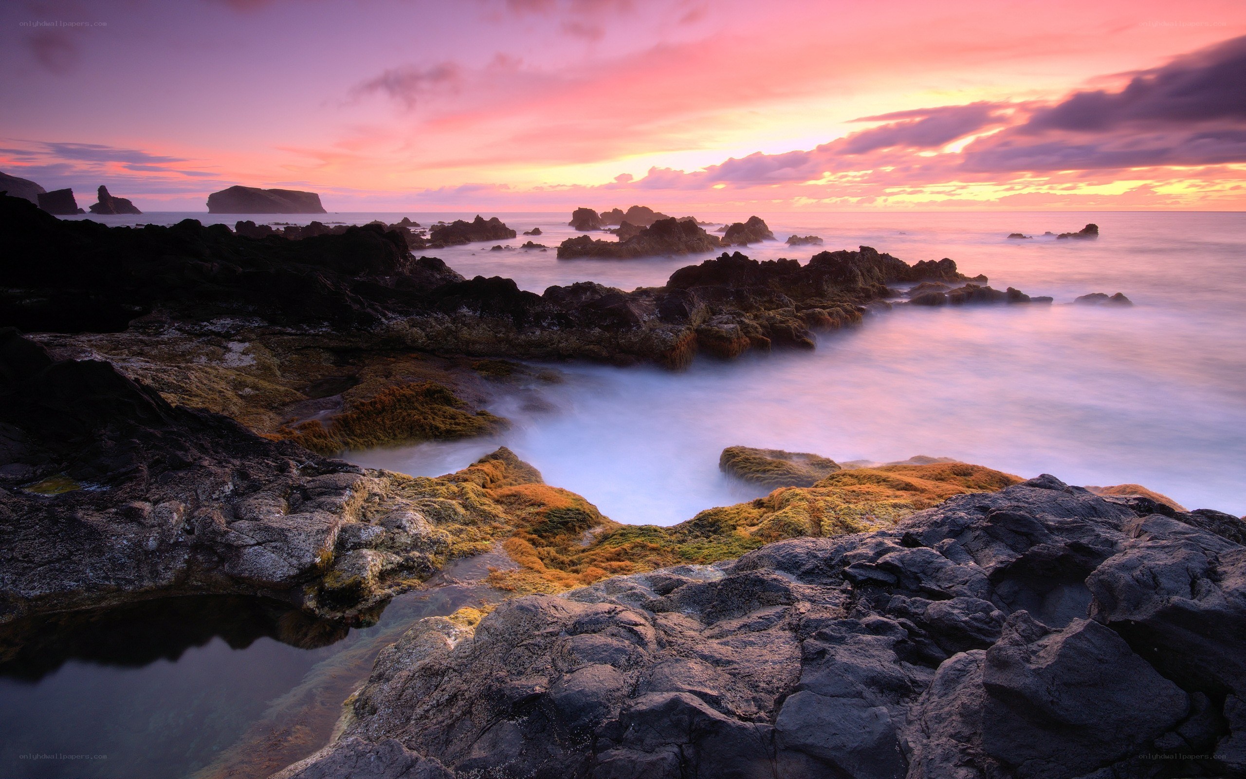 Vibrant sunset over rocky coast