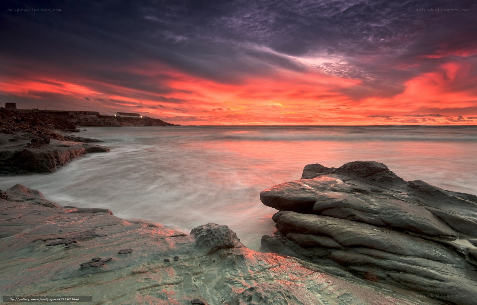 Vibrant sunset over rocky coast
