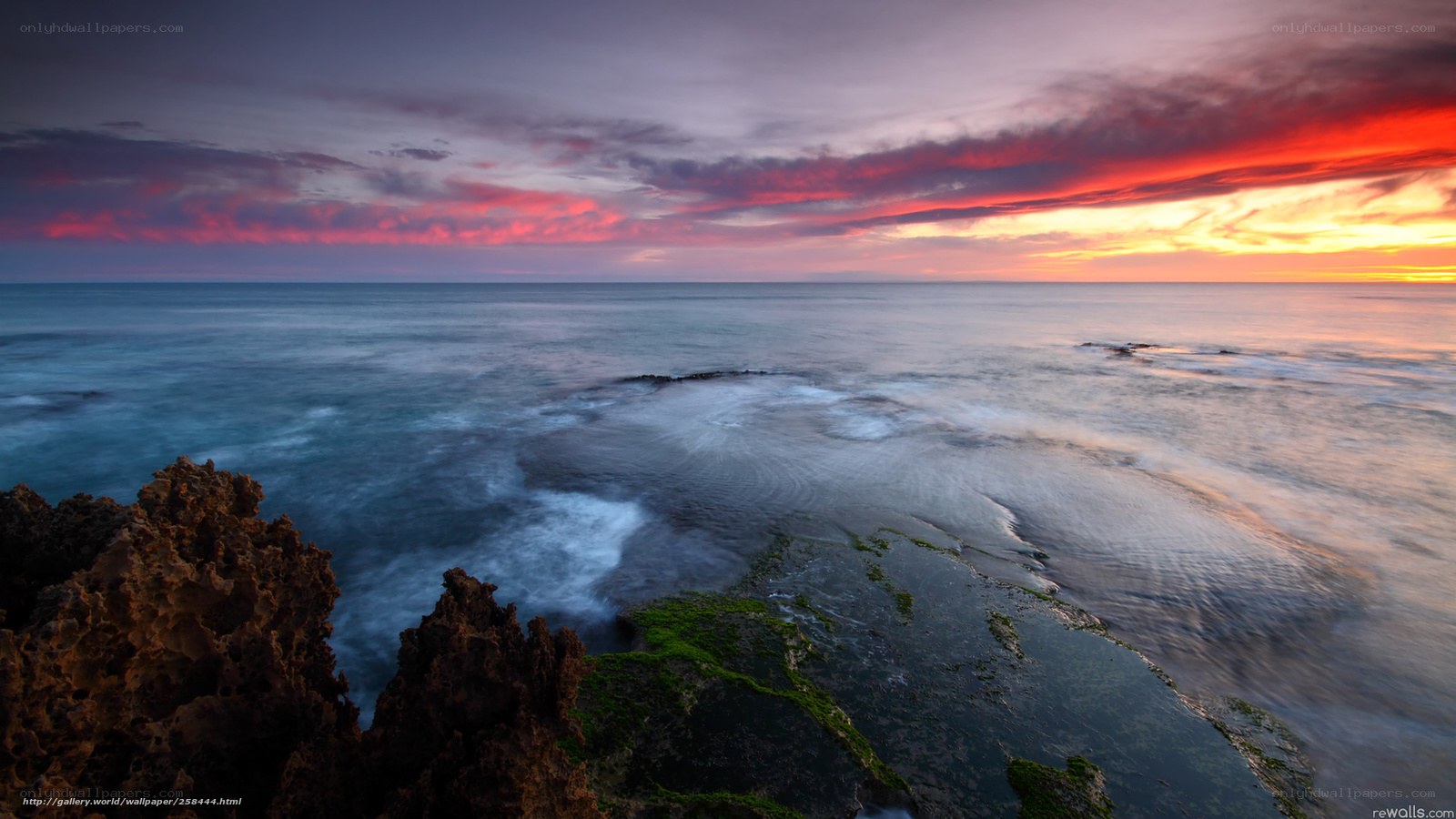 Vibrant sunset over rocky coast