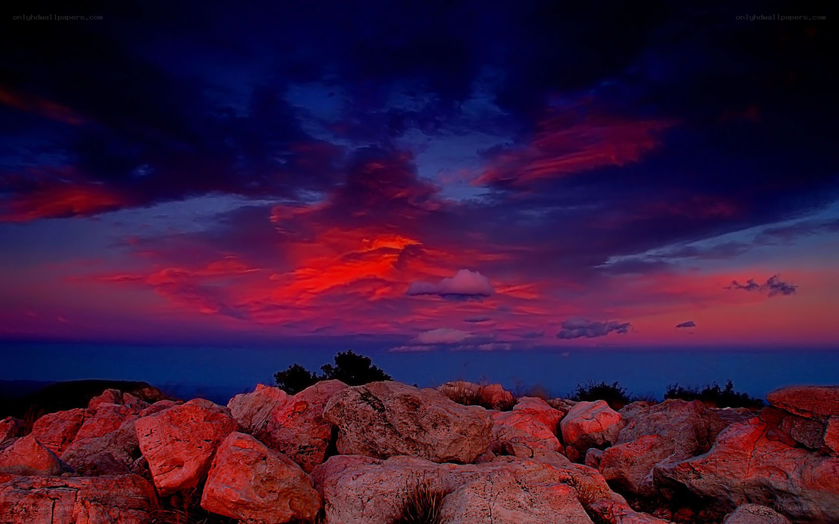Vibrant sunset over rocky landscape