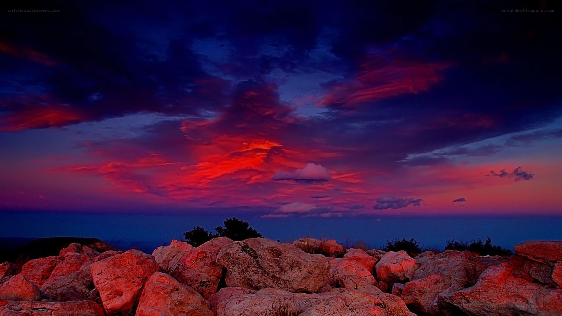Vibrant sunset over rocky landscape
