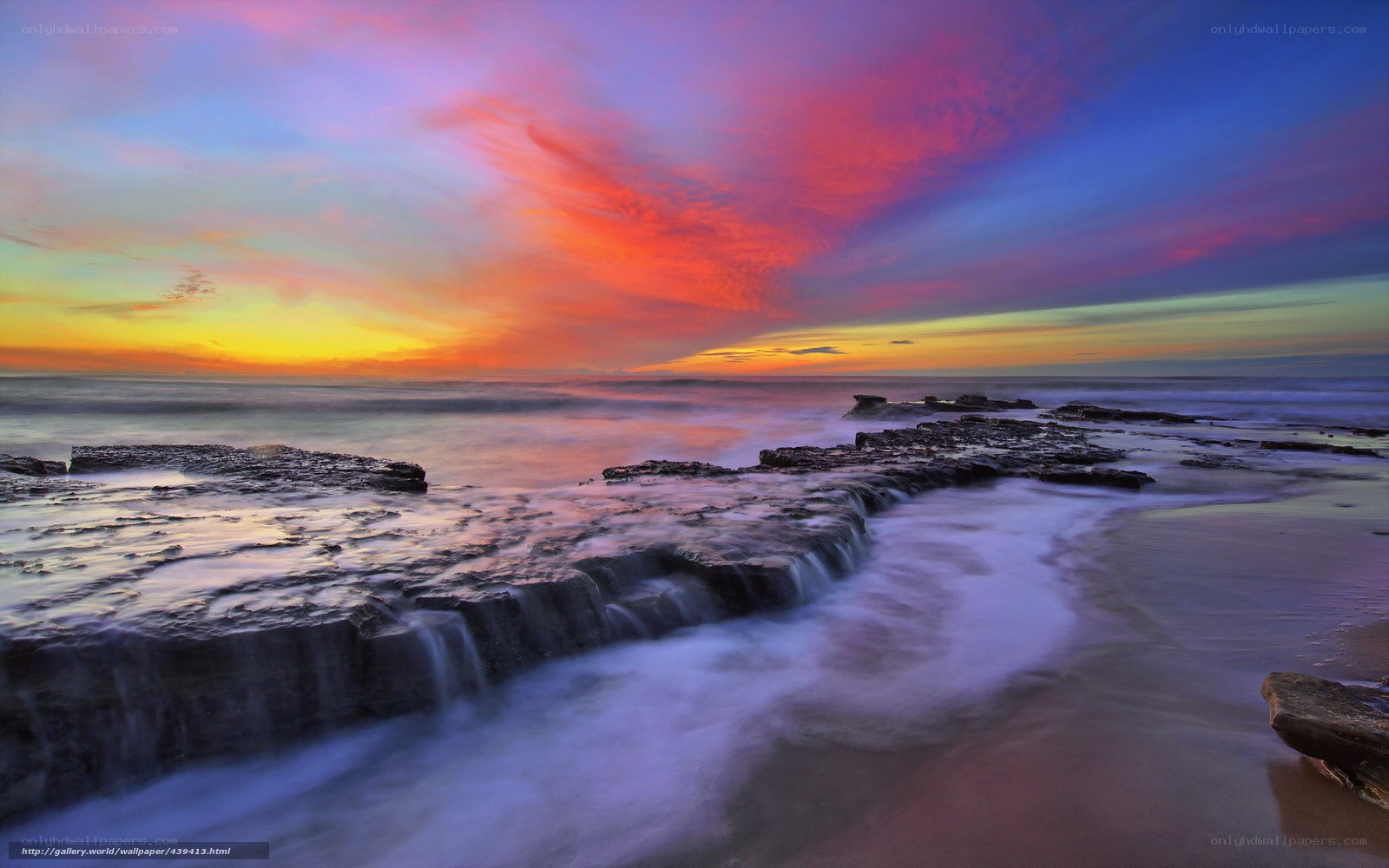 Vibrant sunset over rocky shore