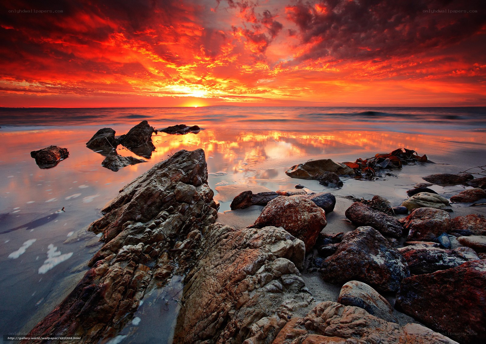 Vibrant sunset over rocky shore