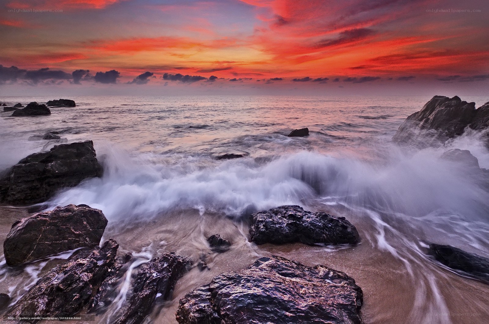 Vibrant sunset over rocky shore