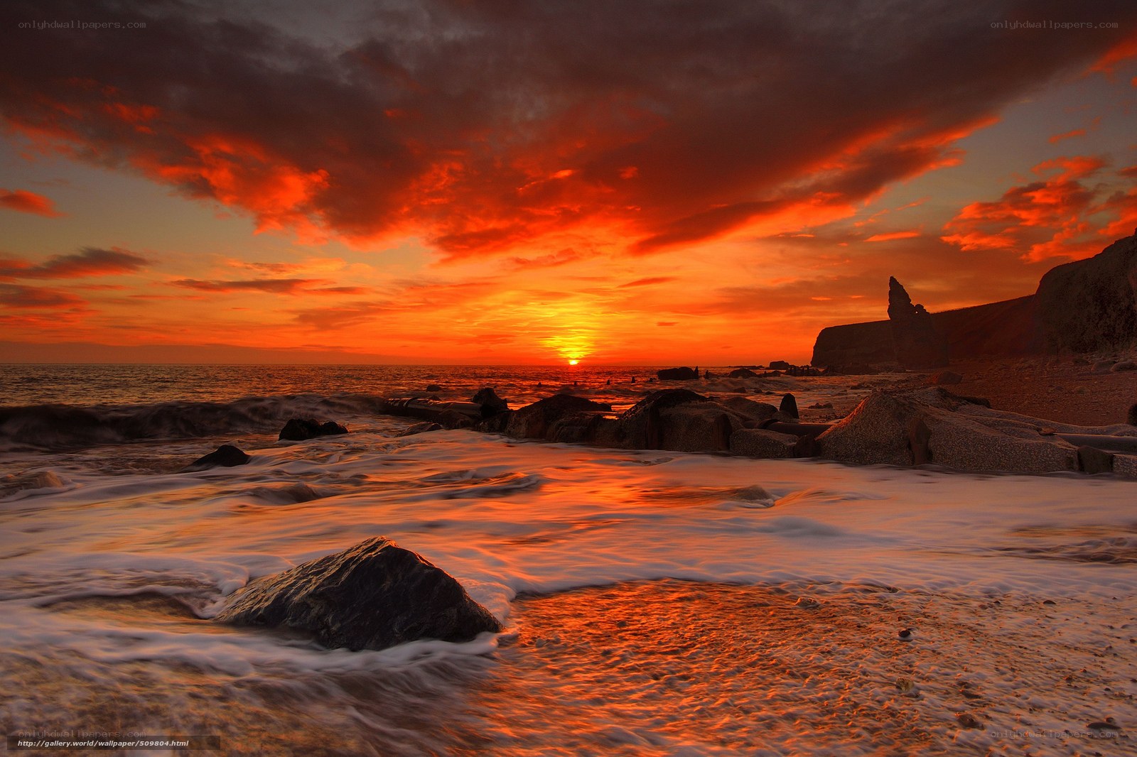 Vibrant sunset over rocky shore