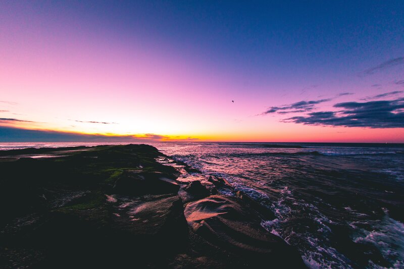 Vibrant sunset over rocky shore