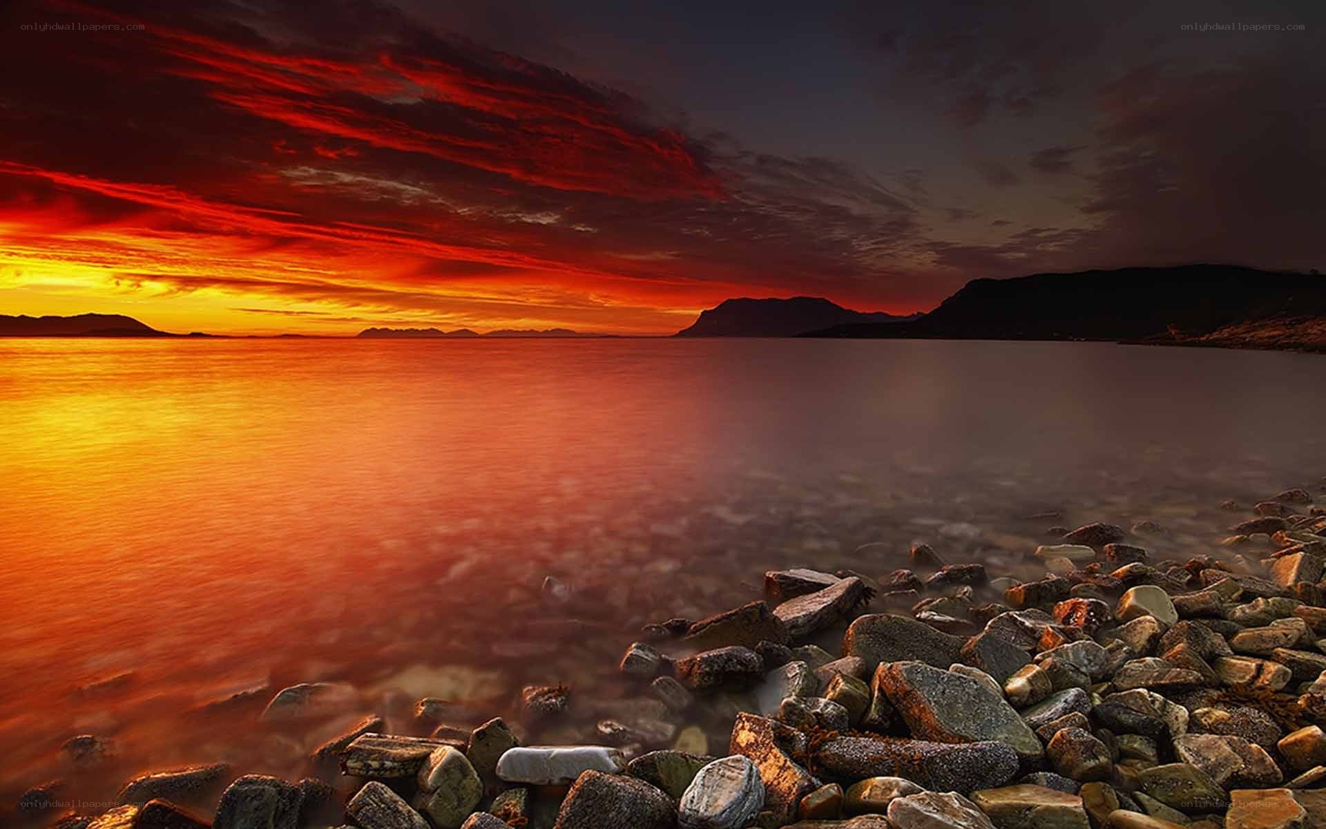 Vibrant sunset over rocky shore