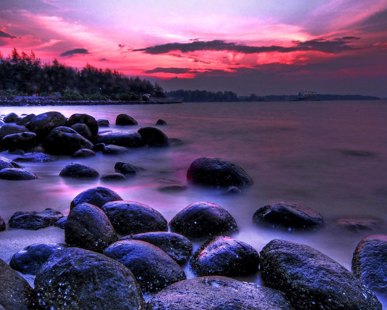 Vibrant sunset over rocky shore