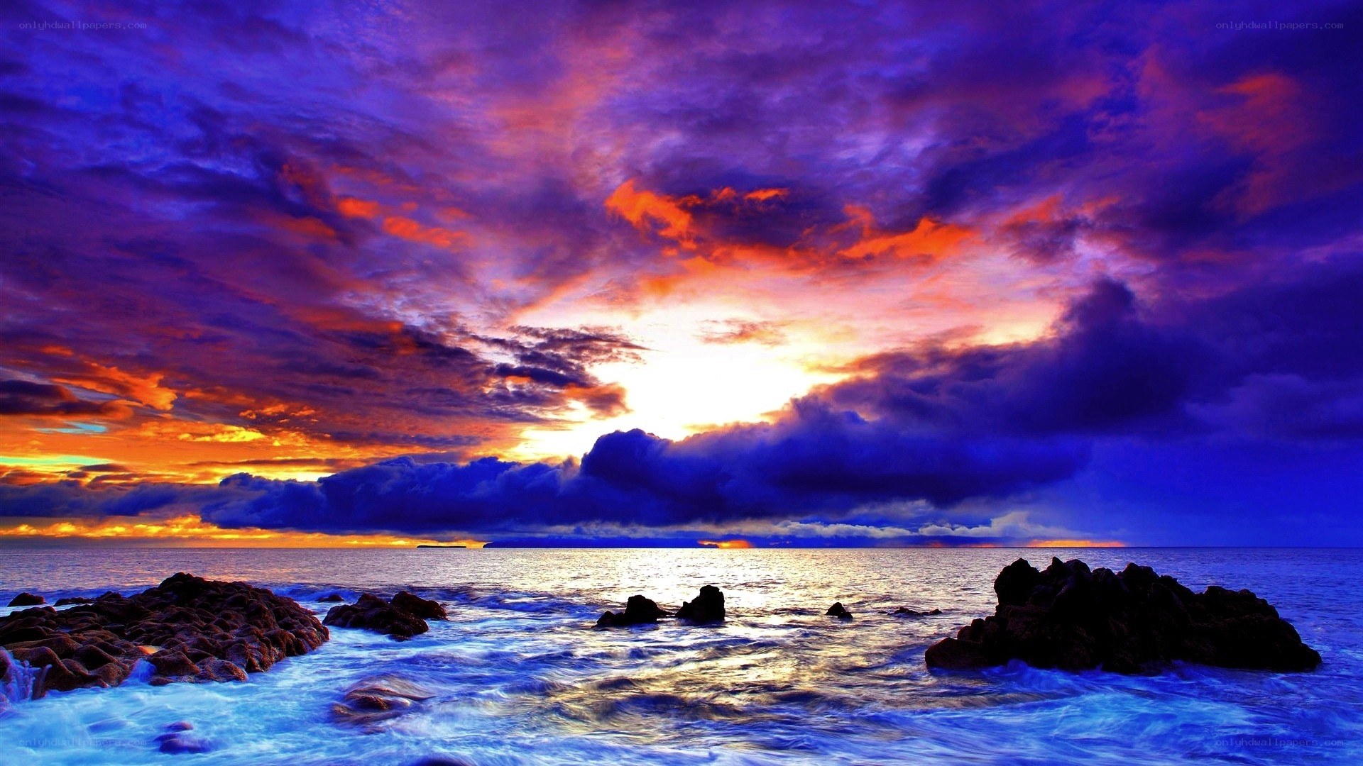 Vibrant sunset over rocky shore