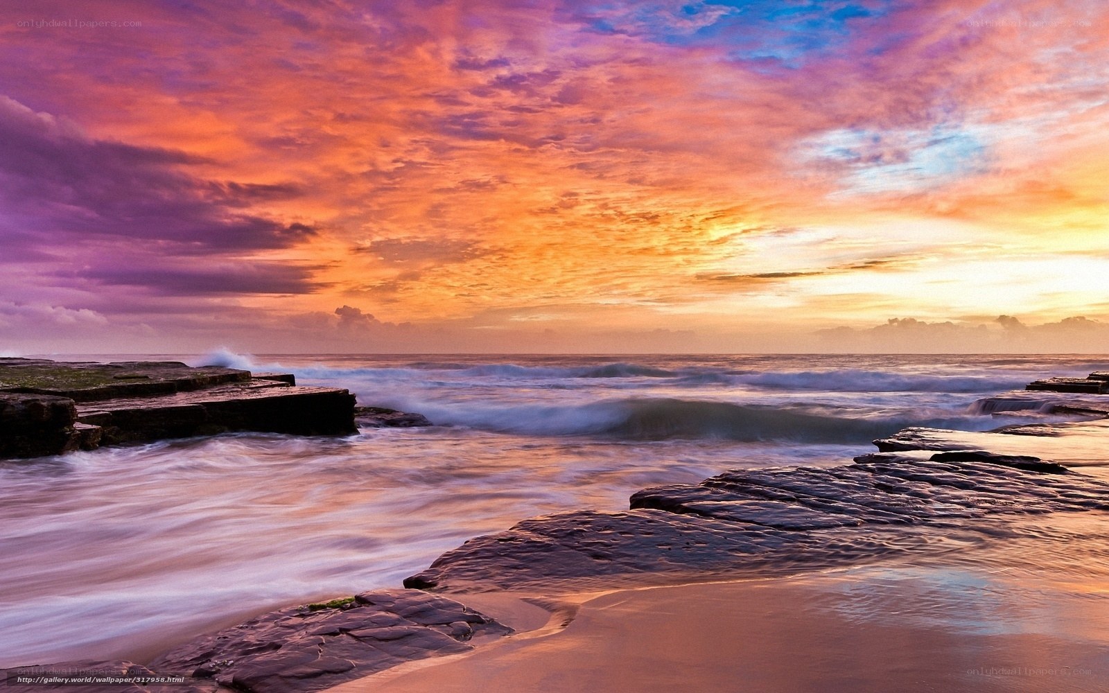 Vibrant sunset over rocky shore