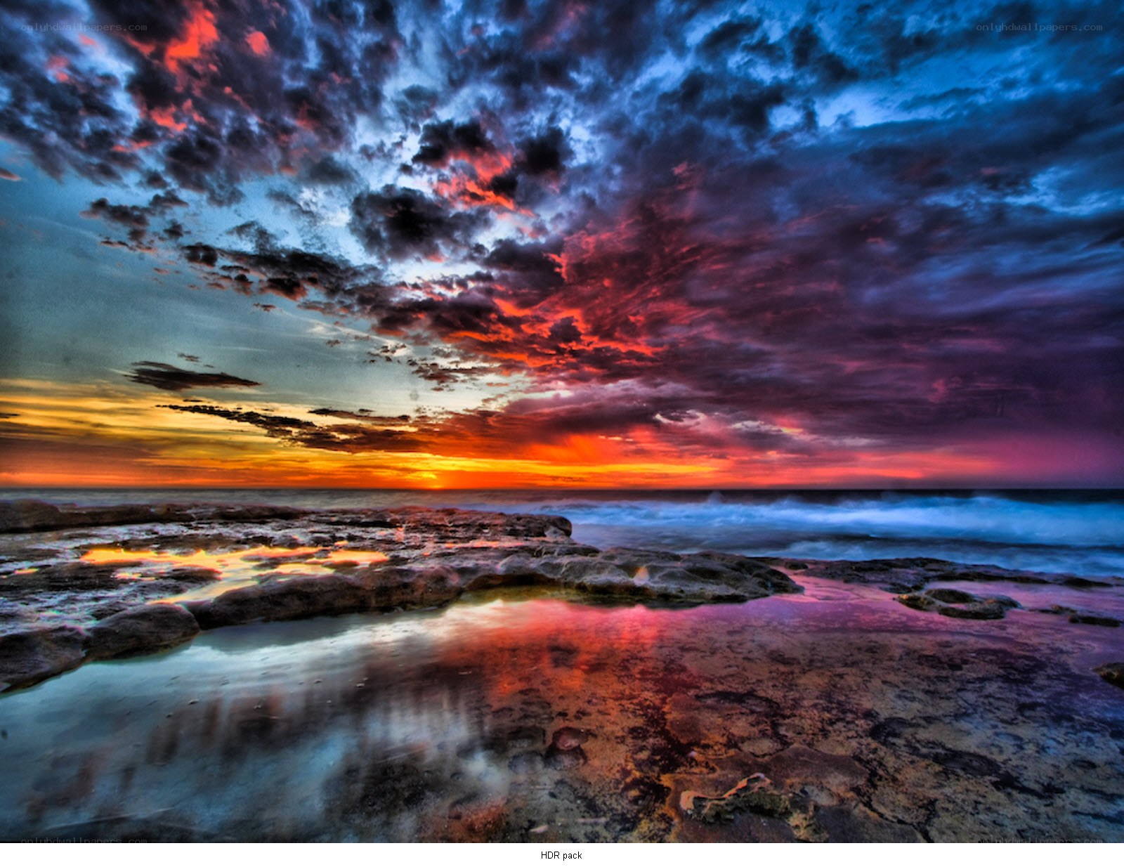 Vibrant sunset over rocky shore