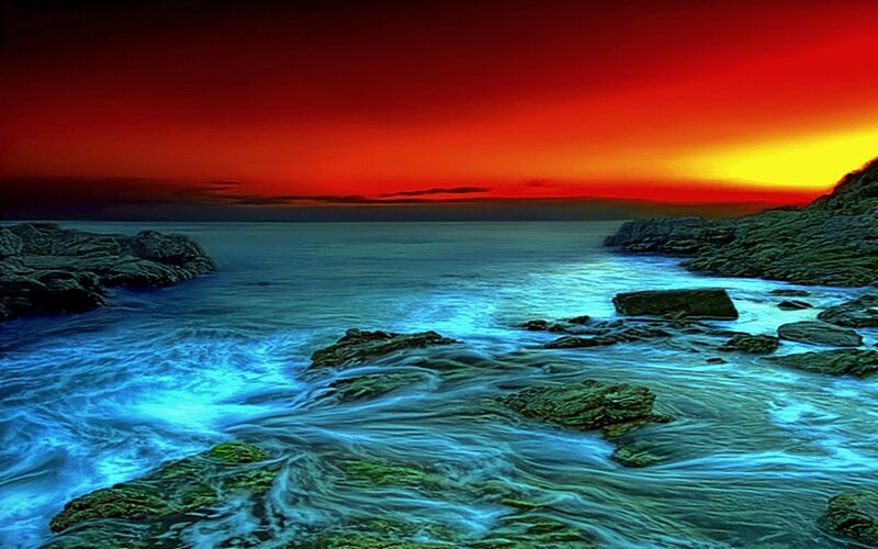 Vibrant sunset over rocky shore