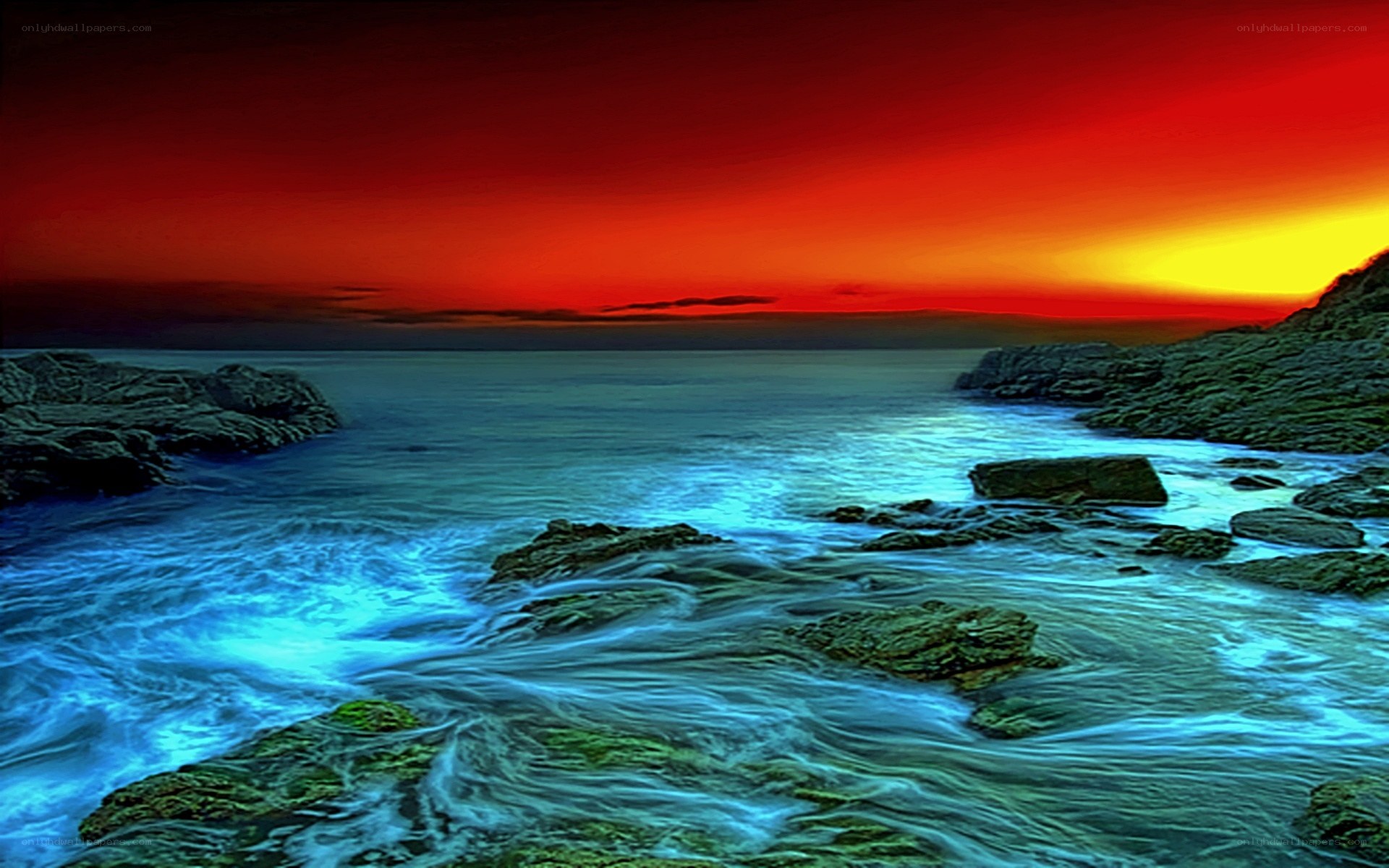 Vibrant sunset over rocky shore