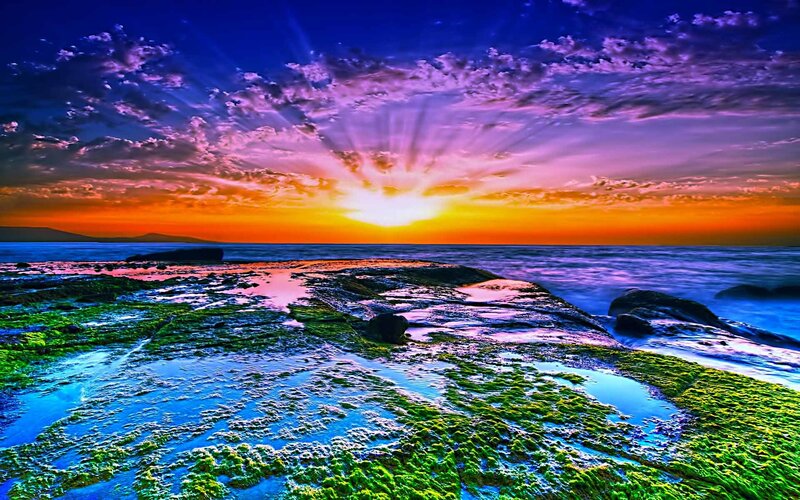 Vibrant sunset over rocky shore