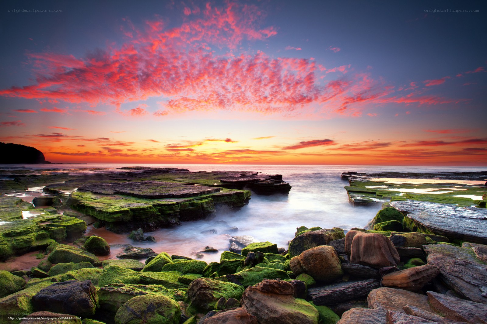 Vibrant sunset over rocky shore