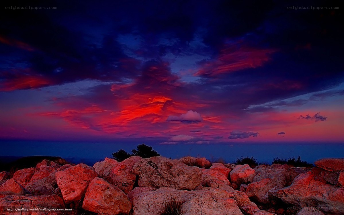 Vibrant sunset over rocky shore