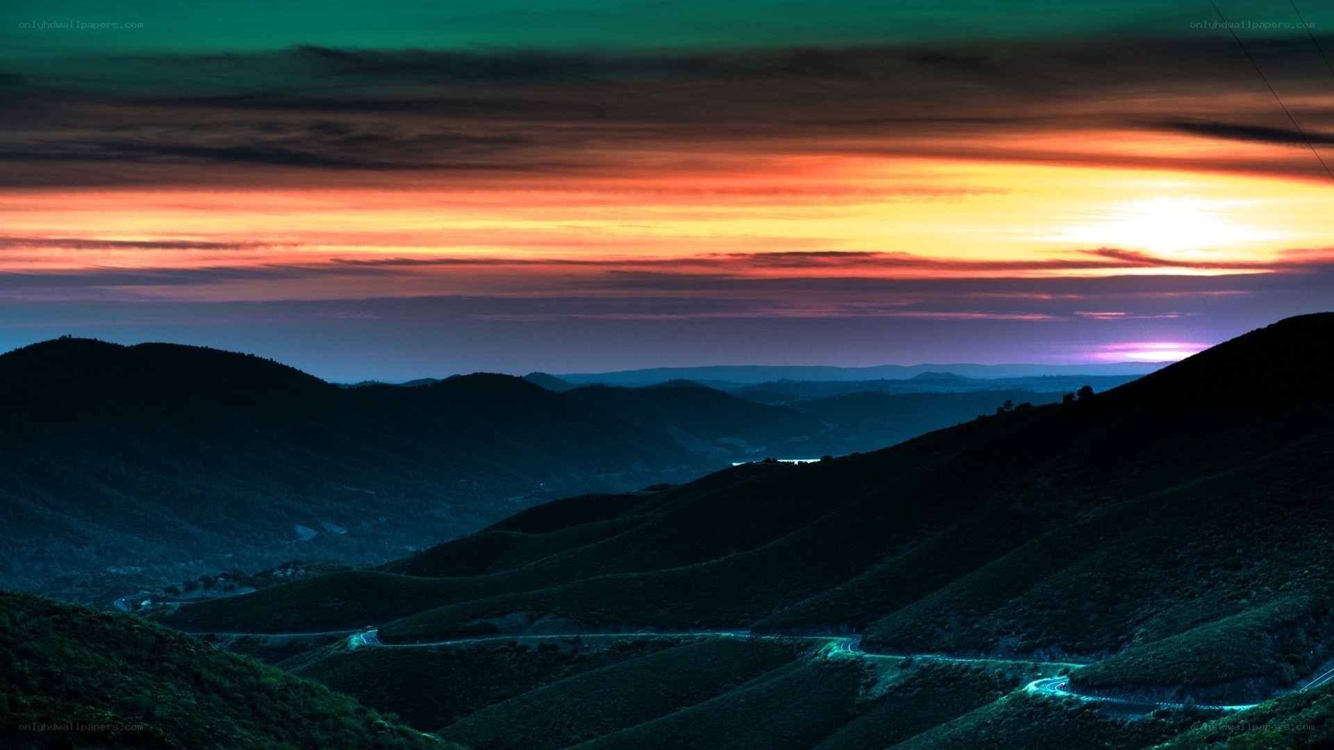 Vibrant sunset over rolling hills