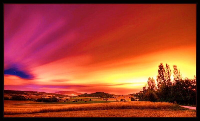 Vibrant sunset over rolling hills