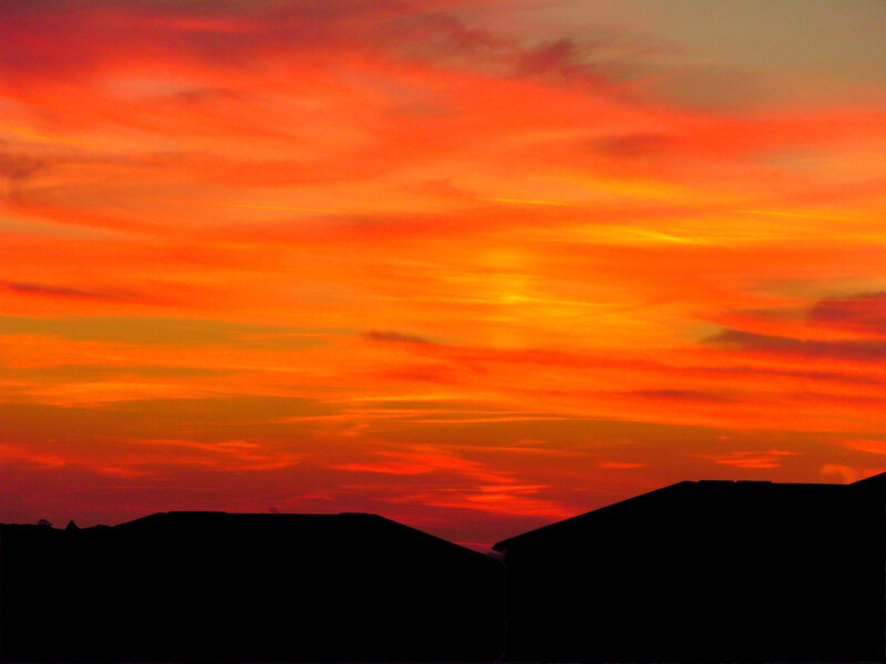 vibrant sunset over rooftops