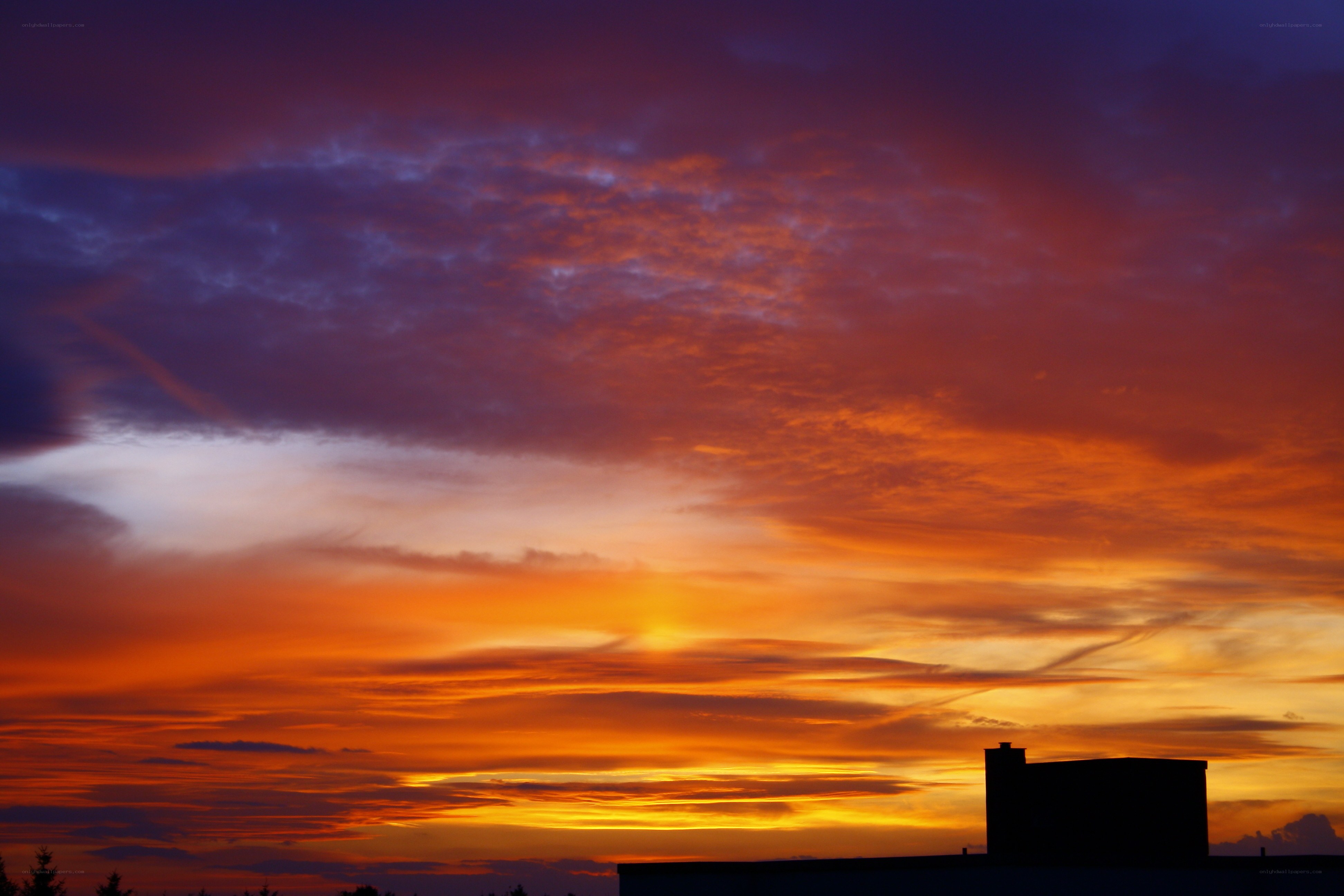 Vibrant sunset over rooftops