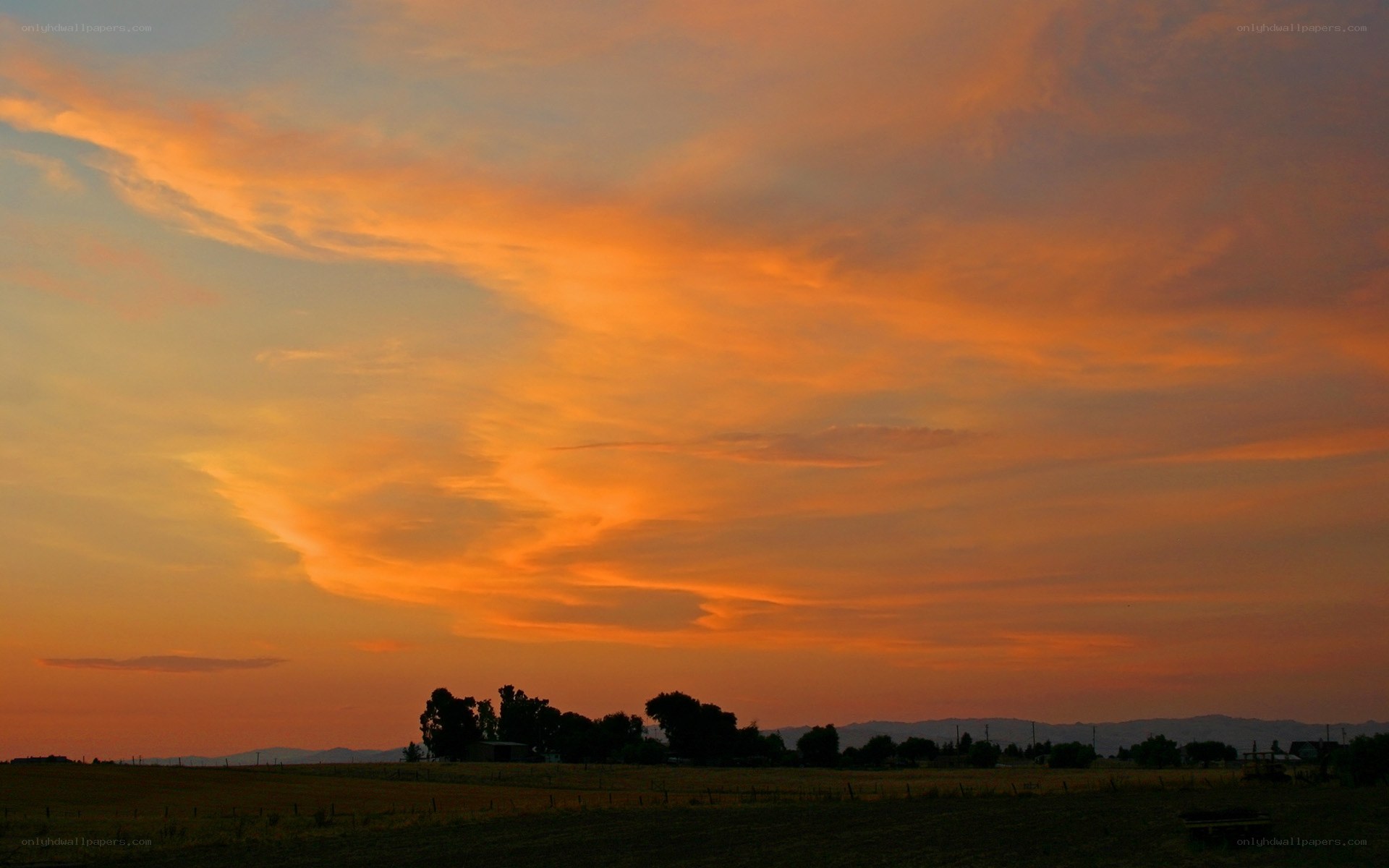 Vibrant sunset over rural landscape