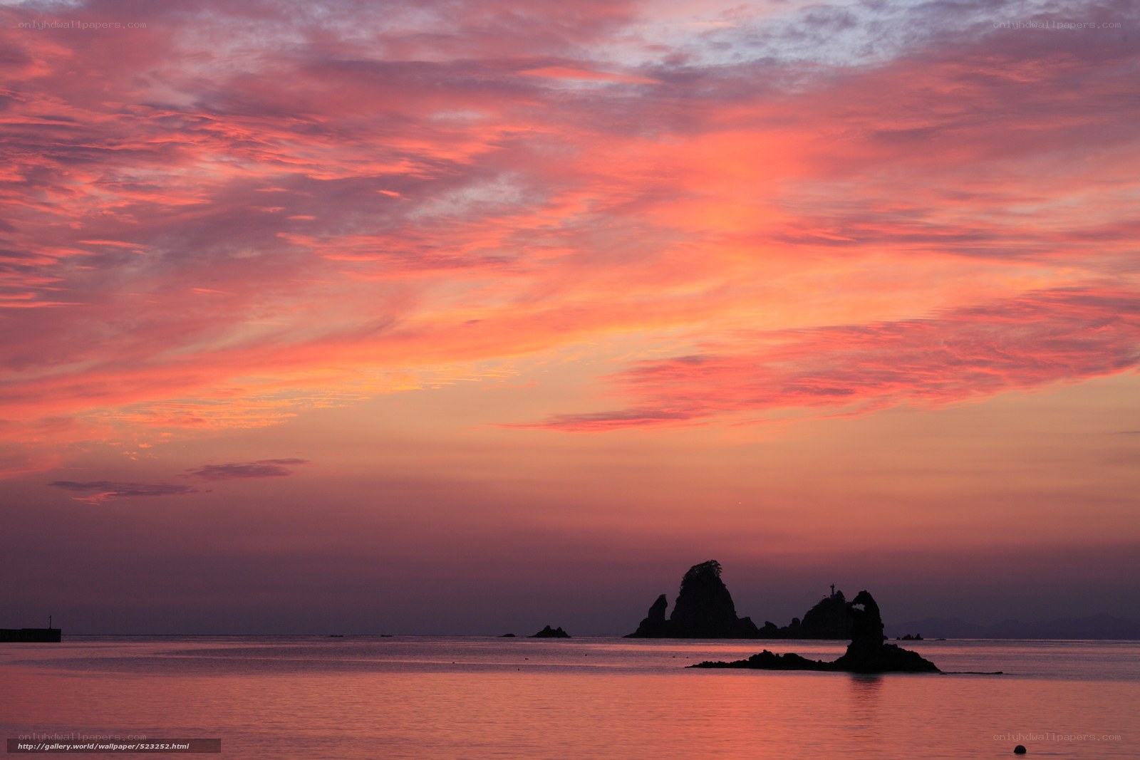 Vibrant sunset over sea rocks