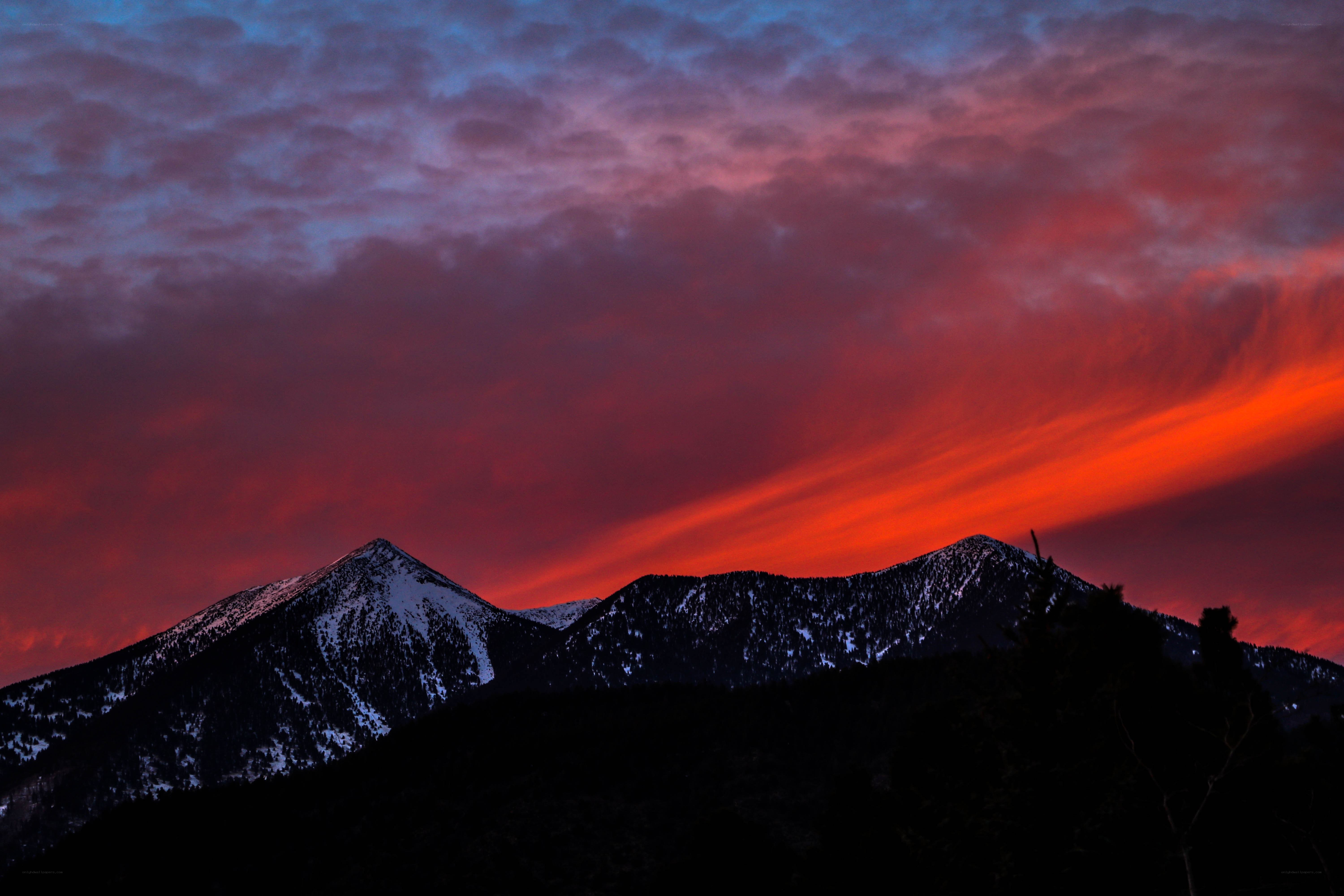 Vibrant sunset over snow-capped mountains