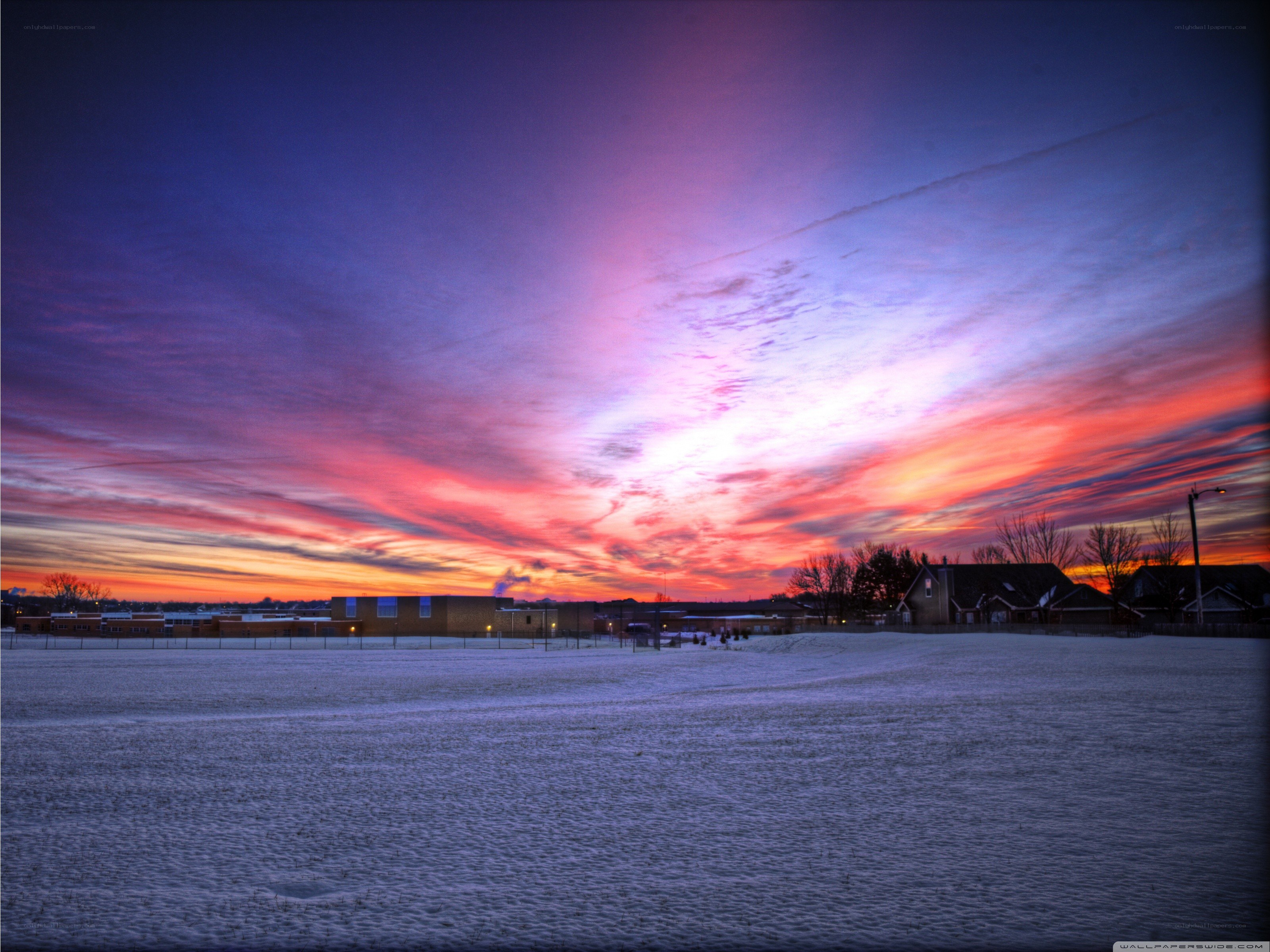 Vibrant sunset over snowy field